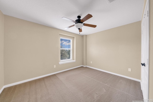 unfurnished room featuring a textured ceiling and carpet flooring