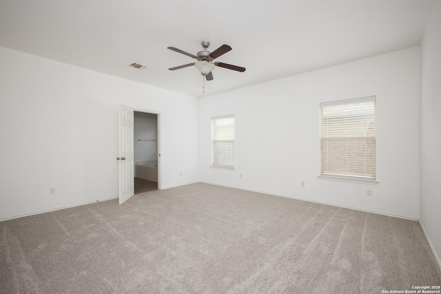 spare room with ceiling fan and carpet flooring