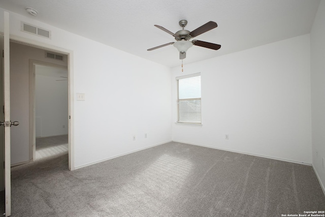 carpeted empty room with ceiling fan