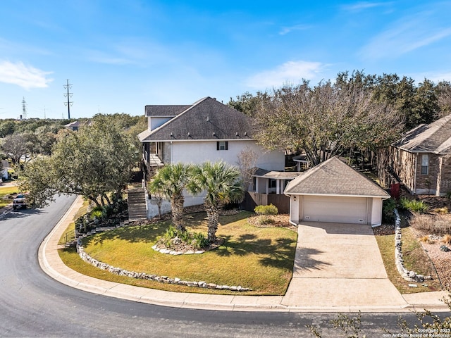 view of front of house featuring a front yard and a garage