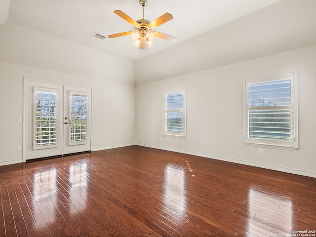 unfurnished room with ceiling fan, french doors, lofted ceiling, and dark hardwood / wood-style floors