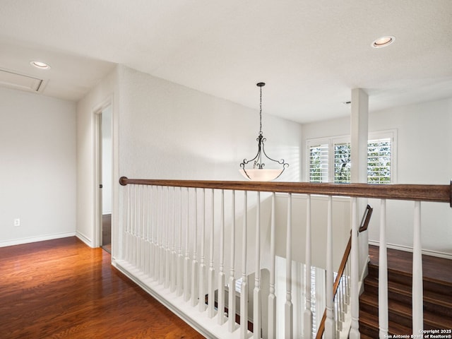 hallway with dark hardwood / wood-style floors