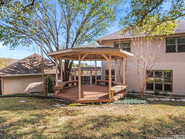 deck with a yard and a gazebo