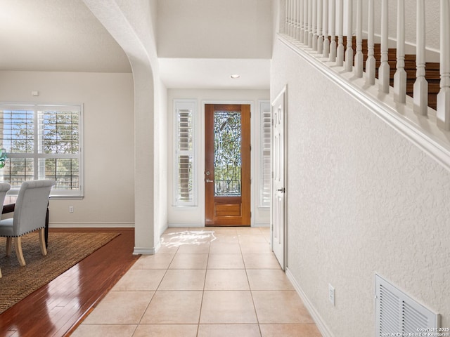 foyer with light tile patterned floors