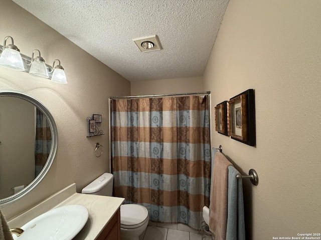 bathroom featuring tile patterned flooring, a shower with shower curtain, vanity, a textured ceiling, and toilet