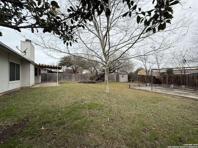 view of yard with a pergola, a shed, and a patio area