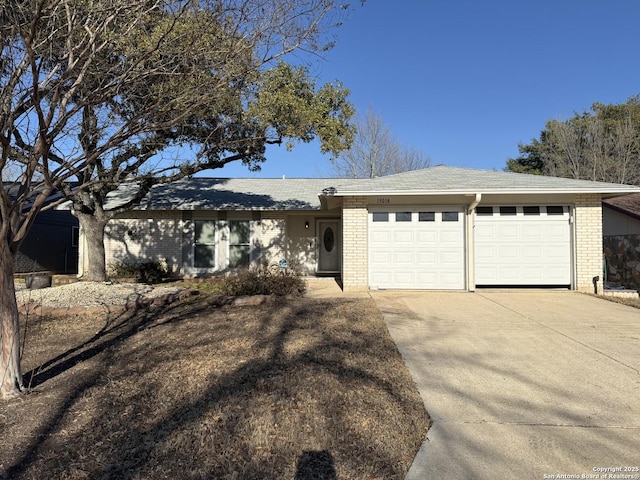 single story home with a garage