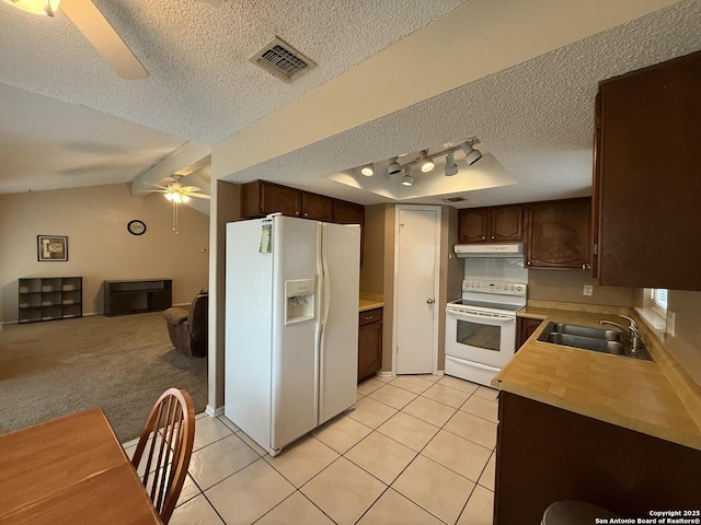 kitchen featuring ceiling fan, white appliances, dark brown cabinetry, and sink