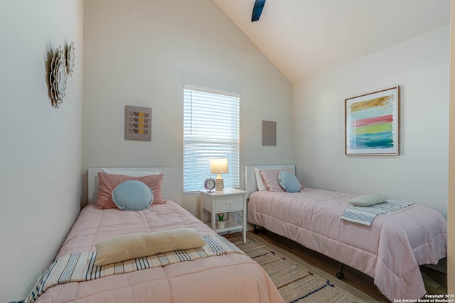 bedroom featuring vaulted ceiling, ceiling fan, and wood-type flooring