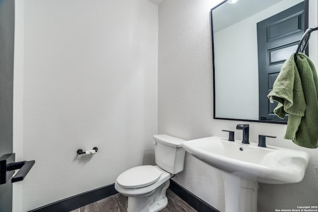 bathroom with sink and toilet