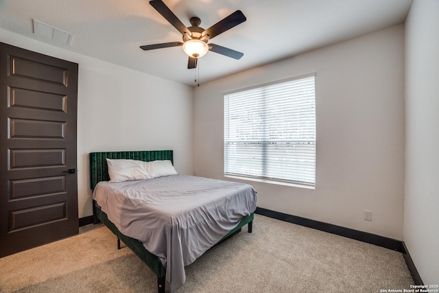 bedroom with light colored carpet and ceiling fan