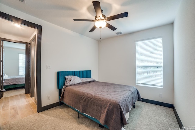 carpeted bedroom with ceiling fan