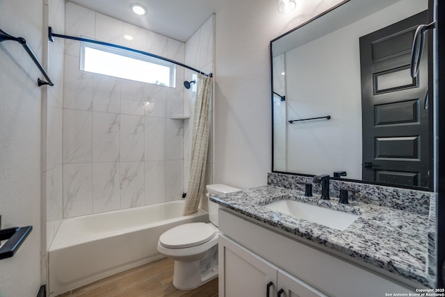 full bathroom featuring vanity, toilet, shower / tub combo, and hardwood / wood-style floors