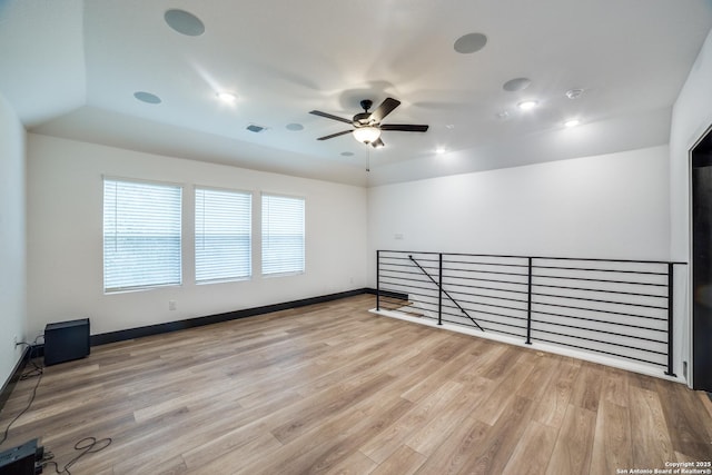 spare room with ceiling fan and light hardwood / wood-style flooring