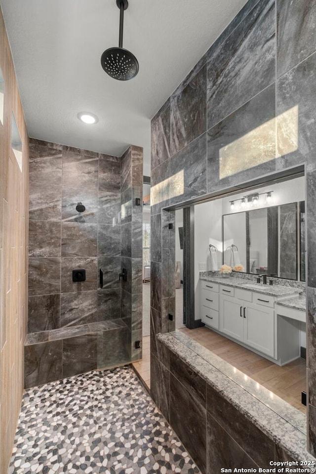 bathroom with vanity and an enclosed shower