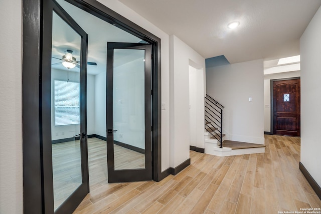 hall with light hardwood / wood-style flooring