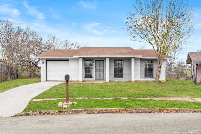 ranch-style house featuring a garage and a front yard