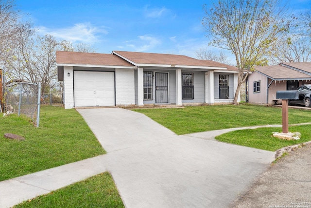 single story home featuring a front lawn and a garage