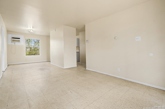 empty room featuring a wall unit AC