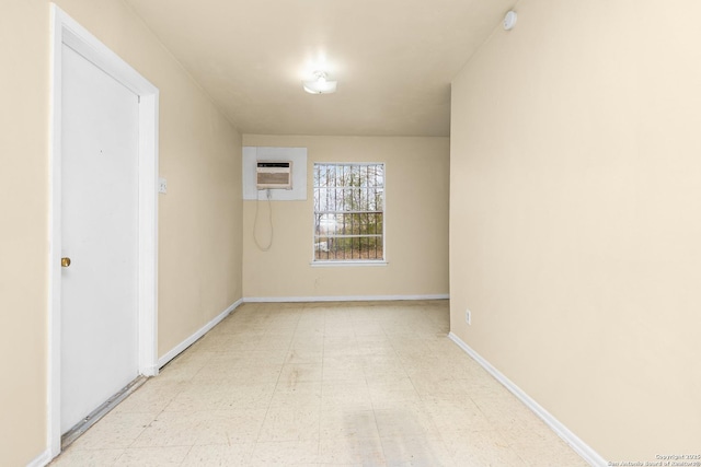 unfurnished room featuring a wall mounted air conditioner