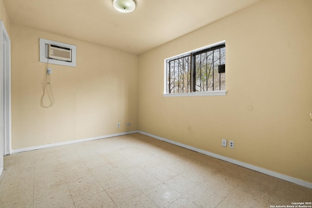 unfurnished room with a wall mounted air conditioner