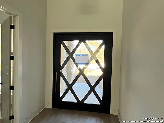 doorway to outside with hardwood / wood-style floors