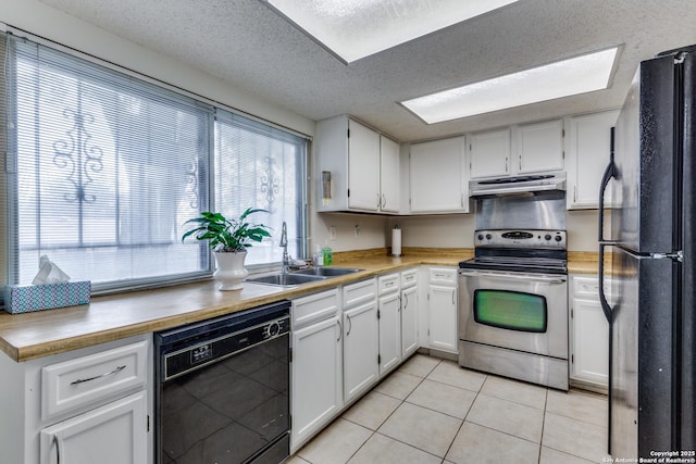 kitchen with sink, black appliances, a textured ceiling, light tile patterned floors, and white cabinets