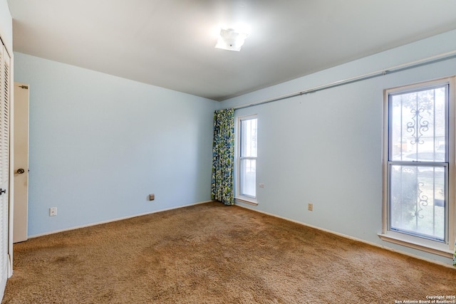 unfurnished room featuring carpet floors