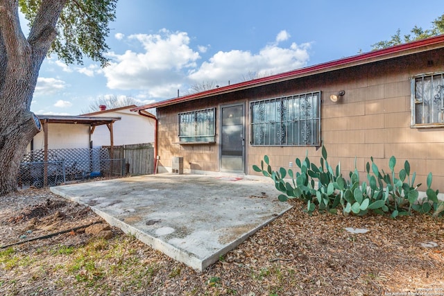 rear view of house with a patio