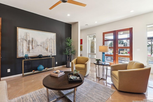 sitting room featuring ceiling fan