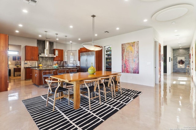 dining room featuring sink