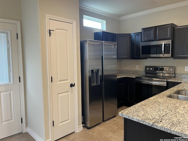 kitchen with light stone countertops, light tile patterned floors, appliances with stainless steel finishes, ornamental molding, and sink