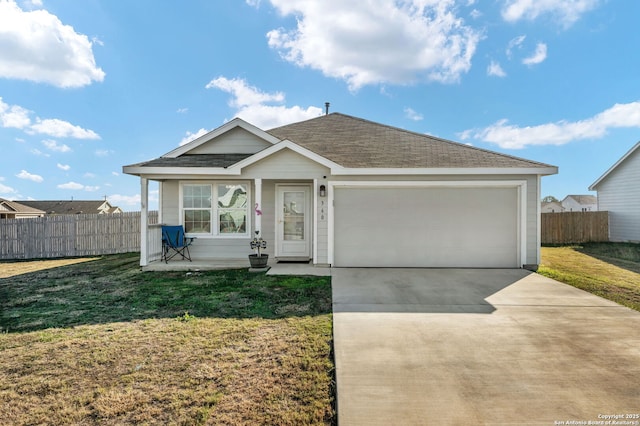 view of front of house featuring a front lawn and a garage