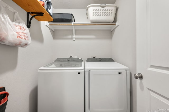 washroom with washer and clothes dryer