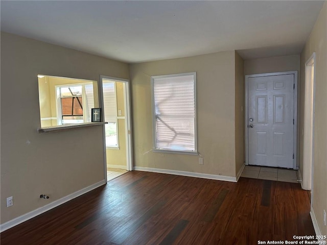 unfurnished room featuring dark hardwood / wood-style floors