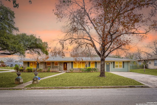 ranch-style house with a lawn