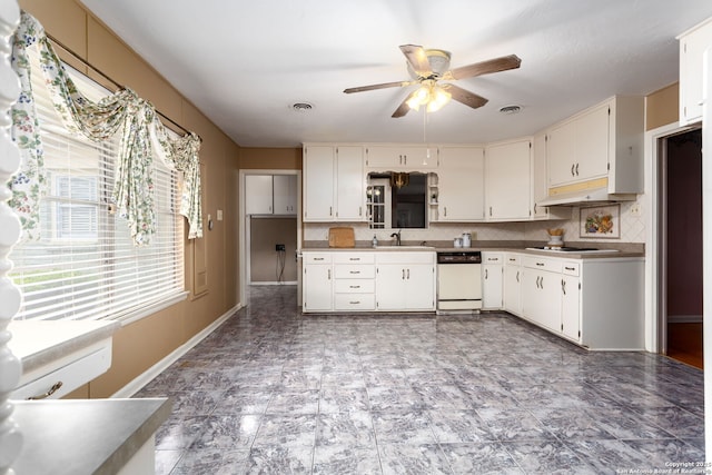 kitchen with white appliances, tasteful backsplash, white cabinets, ceiling fan, and sink