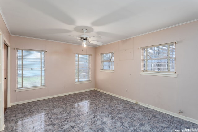 unfurnished room with ceiling fan and crown molding