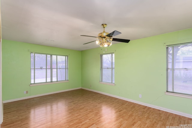 empty room featuring ceiling fan and light hardwood / wood-style floors