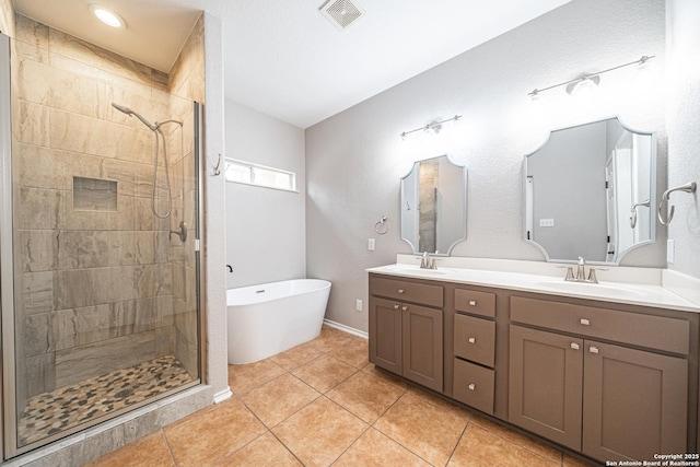 bathroom with vanity, separate shower and tub, and tile patterned flooring