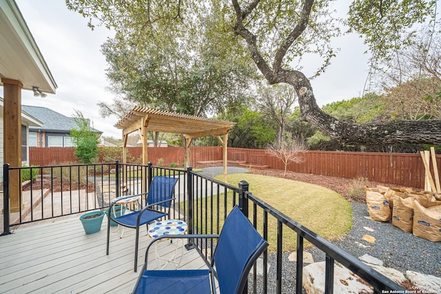 deck with a pergola and a lawn