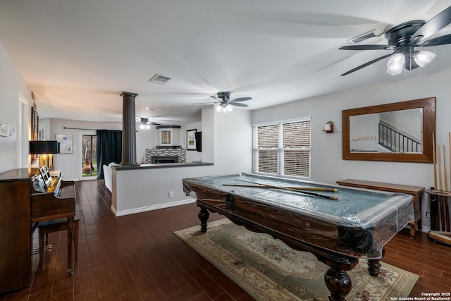 playroom with a stone fireplace, pool table, plenty of natural light, and dark wood-type flooring