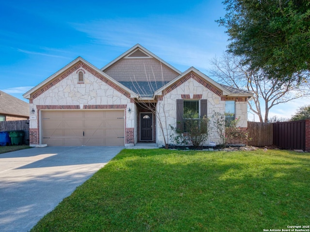 view of front of home with a front lawn and a garage