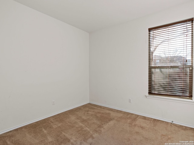 empty room with light colored carpet