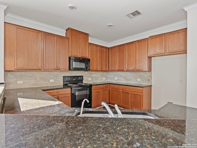 kitchen featuring sink, dark stone countertops, decorative backsplash, black appliances, and crown molding