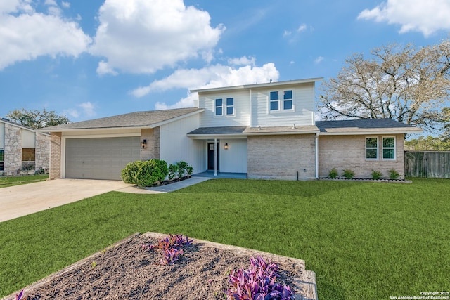 view of front of home with a garage and a front lawn