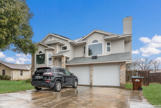 view of front of property with a garage