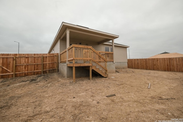 rear view of house with a deck