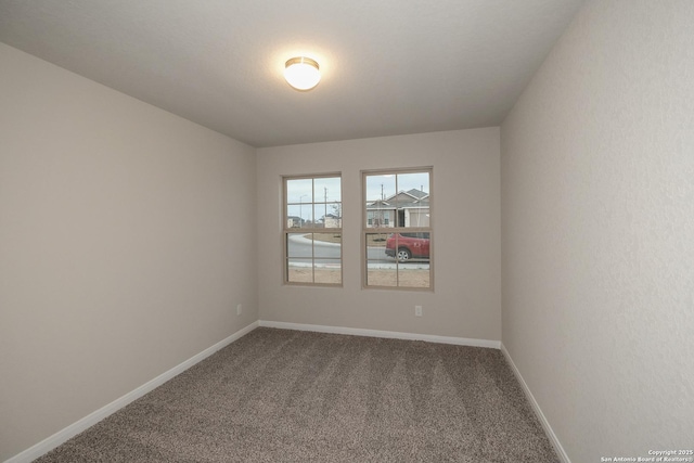 spare room featuring carpet flooring