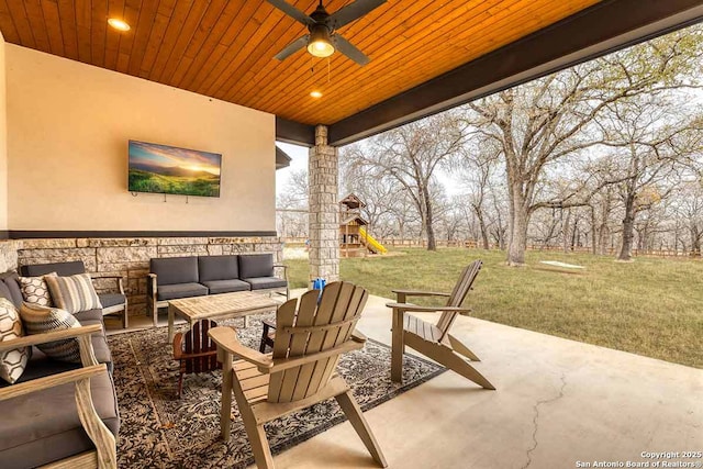 view of patio / terrace featuring ceiling fan, a playground, and outdoor lounge area